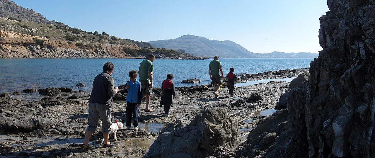 Rocks at Glister beach looking across bay to Pefkos on the horizon - panoramio, Rhodes